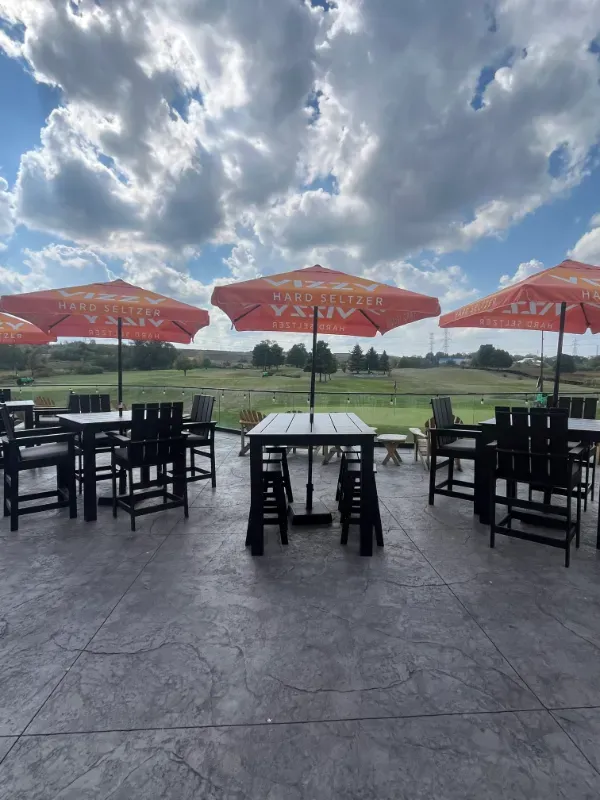 Dramatic clouds fill the sky in front of the pro shop patio.