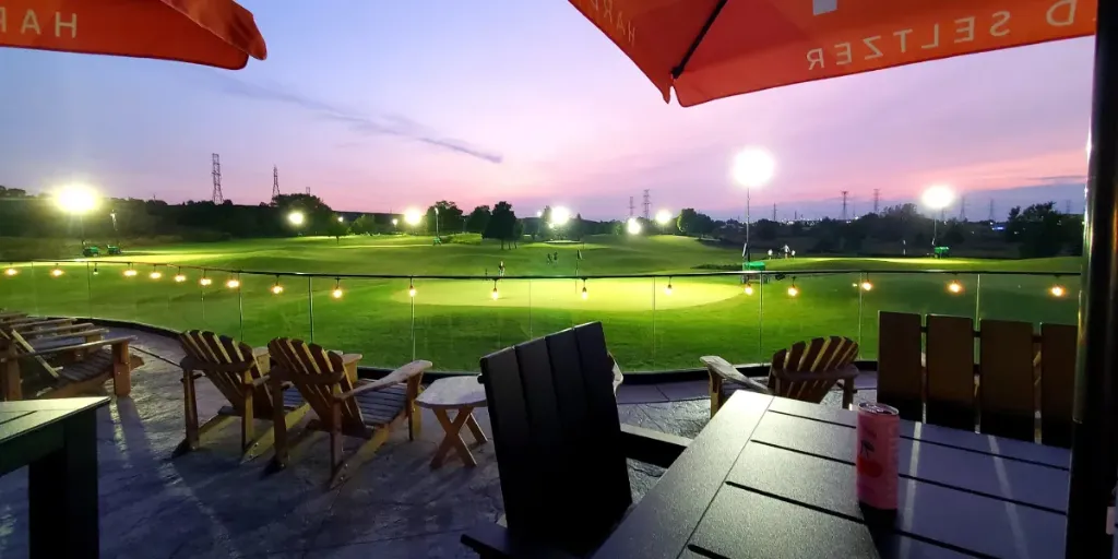 From the patio of the pro shop, the sun begins to set over the Badlands golf course.